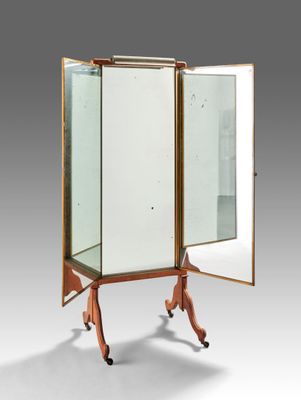 an old fashioned mirrored cabinet with a mirror on top of it