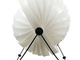 a white lamp that is on a stand on a white background