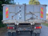 a dump truck that is parked on the side of the road