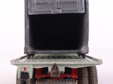 a toy truck with a door open on a white surface