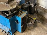 a blue machine that is sitting in a garage