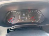 a close up of a car dashboard with a speedometer and gauges