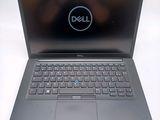 a close up of a laptop with a dell logo on the screen