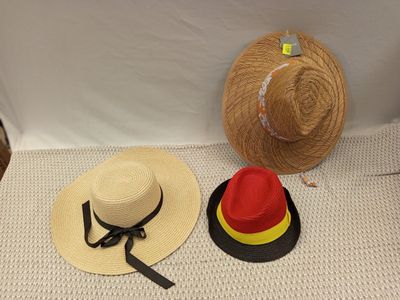 two hats that are sitting on top of a table
