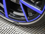 a close up of a tire on a metal grate