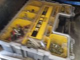 a tool box with many tools in it on a table