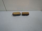 two toy buses that are sitting on a table