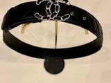 a close up of a black belt with a flower on it