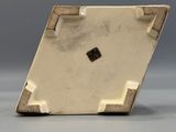 an image of a white square shaped object on a gray surface