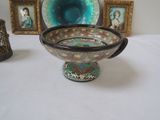 a picture of a bowl with a handle and a picture of a woman in a picture frame