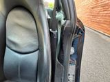 a picture of the inside of a car with the door open