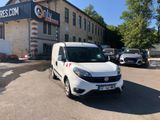 a white van parked in front of a building