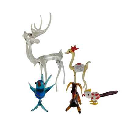five figurines of different shapes and sizes on a white background