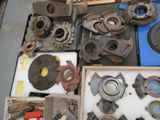 many different types of metal parts on a table