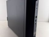 the computer is sitting on a white surface with a white background