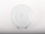 a white plate that has a blue and white design on it