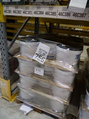 a large stack of boxes on a pallet in a warehouse