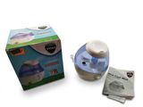 une photo d'un petit humidificateur posé à côté d'une boîte de mouchoirs