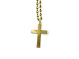 a close up of a cross on a chain on a white background