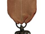 l'image d'une médaille surmontée d'une étoile