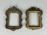 pair of antique gold picture frames on a white background