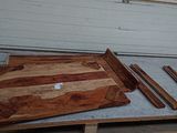 a wooden cutting board sitting on top of a pallet