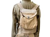 jacket on a mannequin stand with a backpack on it