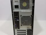 the back of a computer tower with a keyboard on top of it