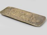 brass plate with a design of a man and a woman on a horse