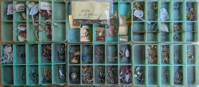 many different types of jewelry in this box