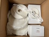 a box with a couple of rolls of white tape in it