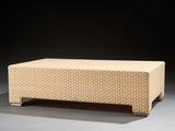 an image of a coffee table with a beige cover on it