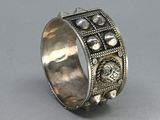 a close up of a silver ring with a lion on it