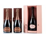 two bottles of champagne in a pink gift box