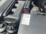 the engine of a car with its hood open and the hood open