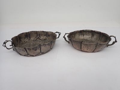 pair of silver plated bowls with handles and handles