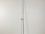 a broom and a broom stand against a wall in an empty room