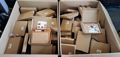 two boxes of boxes that are sitting in the back of a truck