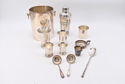 a lot of silverware and spoons on the table