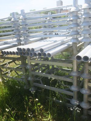 a lot of pipes that are sitting in the grass