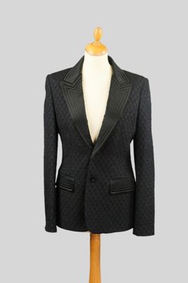 JEAN PAULGAULTIER Femme. Veste cloquée noir, large revers de… - Photo 1