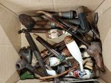 a cardboard box filled with different types of tools