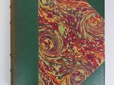 an image of a green book with a red and yellow design on it