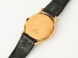an image of a close up of a wrist watch on a white surface