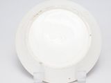 a white plate with a black and white design on it