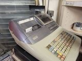 a cash register sitting on a counter in a store