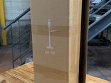 a cardboard box sitting on top of a wooden table