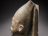an ancient stone head of a man
