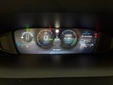 a car dashboard with a digital display on it