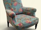 une chaise bleue ornée d'un motif floral